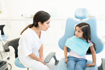 Dentist With Patient At Clinic