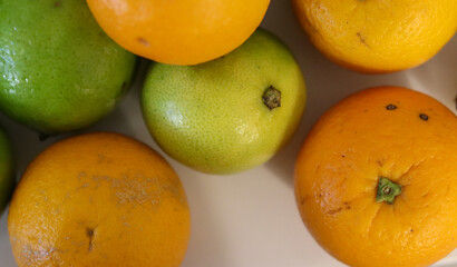 Beautiful lemons and oranges arranged on a table. A fruit rich in vitamin c.