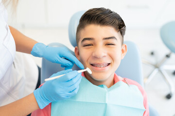 Boy With Braces At Orthodontic Center