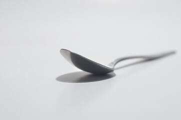Isolated spoon shining on white Background