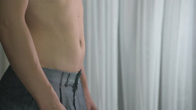 Skinny man with belly fat pulled have pulled their abdominal muscle.