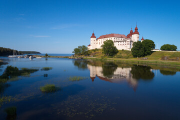 Fototapeta na wymiar The medieval Lacko castle located at the Lake Vanern.