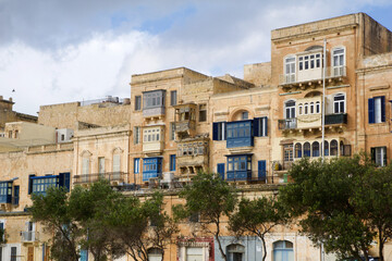VALLETTA, MALTA - DEC 31st, 2019 Typical Maltese buildings with gallarija, traditional enclosed...