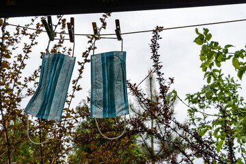 Life hack. Dry washed medical masks for reuse. Blurred background. Selective focus. Lack of masks in pharmacies at affordable prices. Respiratory protection from viruses. Coronavirus Covid-19 pandemic