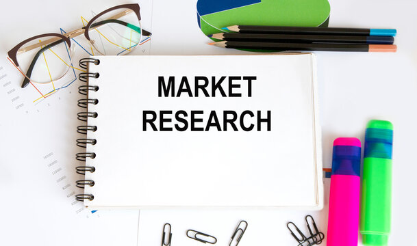 Office Desk with Tools and Notes About Digital Marketing