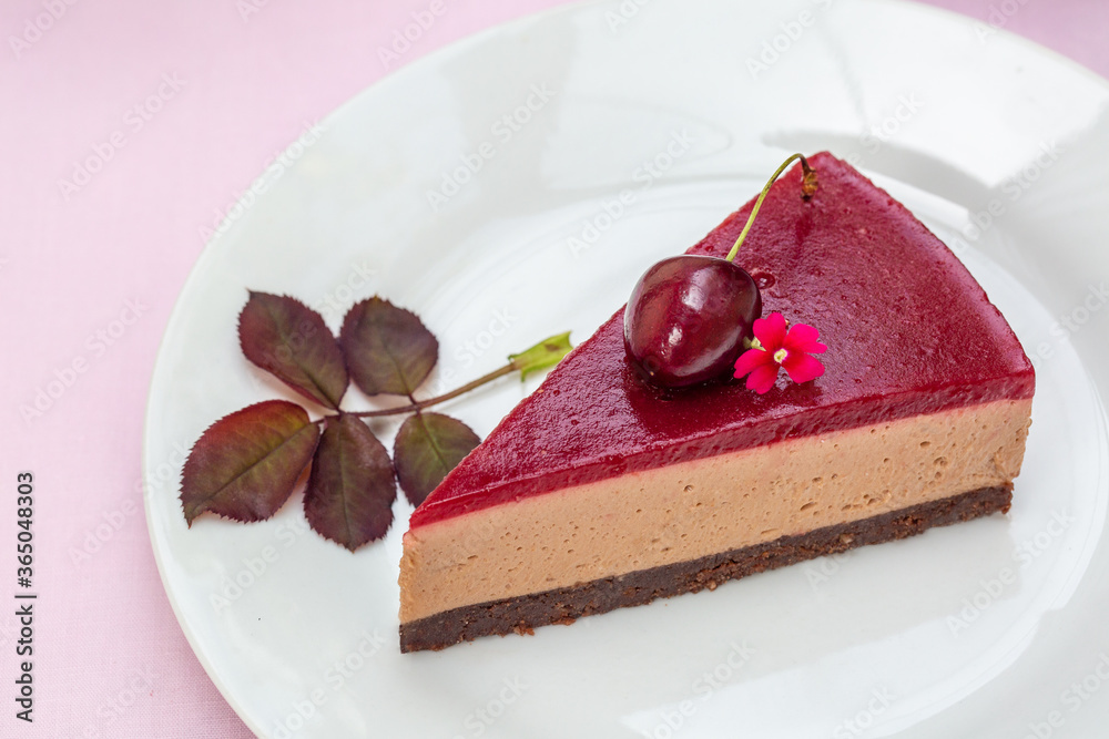 Sticker A piece of no-bake chocolate mousse cake with sweet cherry  jelly on pink background. Organic. Homemade. Top view. Copy space.