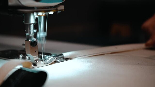 Slow motion sewing machine in action