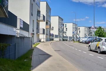 Street with a new apartment building in the cit