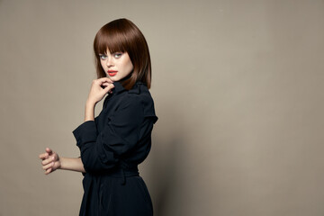 Woman in black coat model new autumn clothes