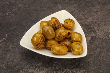 Green grilled olives in the bowl