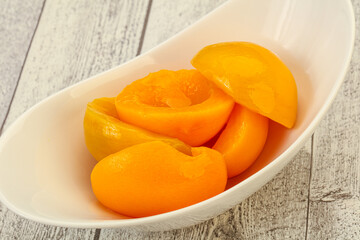 Marinated peaches fruit in the bowl