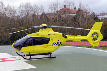 yellow medical helicopter on the runway