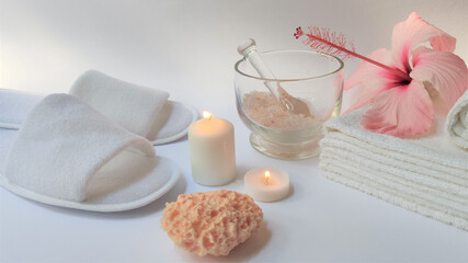 Spa setting and Spa background composition with hibiscus pink flower on white background. Banner. Copy space.