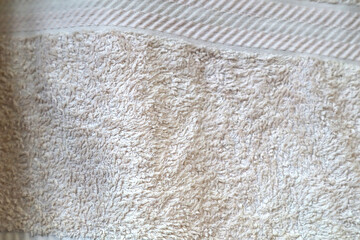An ordinary white fluffy towel dries