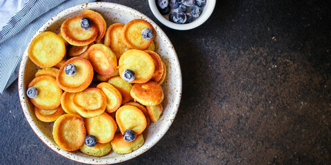 mini pancakes cereal delicious dessert breakfast Menu concept serving size. food background top view copy space 
