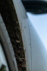 Off-road dirty car. Detail of a car with adhering dirt.
