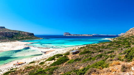 Fototapeta na wymiar Panoramic view to the Balos Lagoon and Gramvousa island with its amazing crystal clear waters and pure white sand, Crete, Greece