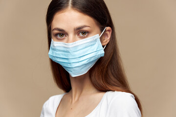 Beautiful girl in white shirt in a protective mask health insurance 