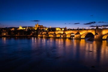 Fototapeta na wymiar Charles Bridge in Prague at Night across River Vltava with Saint Vitus Cathedral and Prague Castle
