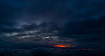Fototapeta na wymiar Aerial Sunset Through Clouds