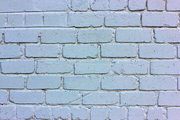 White brick wall: facade of a modern building in bright light