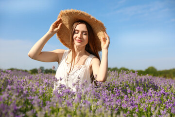 Young woman in lavender field on summer day