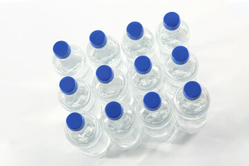 Plastic bottles with pure water on white background