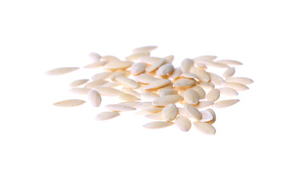 Pile of raw cucumber seeds on white background. Vegetable planting