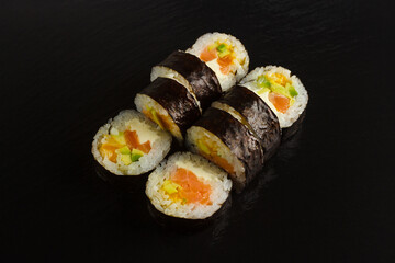Japanese food: Set of salmon sushi and rolls with salmon and eel