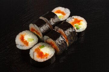 Japanese food: Set of salmon sushi and rolls with salmon and eel