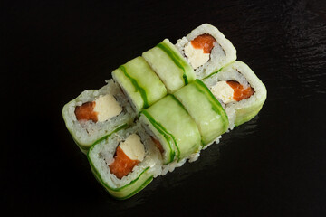 Japanese food: Set of salmon sushi and rolls with salmon and eel