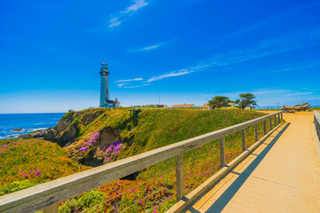 Pigeon Point Lighthouse, Landmark of Pacific Coast Highway (Highway 1) at Big Sur, surrounded with colorful wildflowers in spring time, California