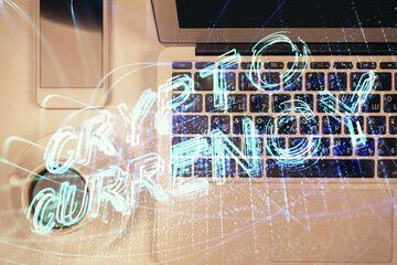Blockchain theme hologram drawings over computer on the desktop background. Top view. Double exposure.