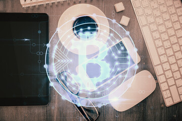 Double exposure of blockchain theme hologram over table with phone. Top view. Crypto technology concept.