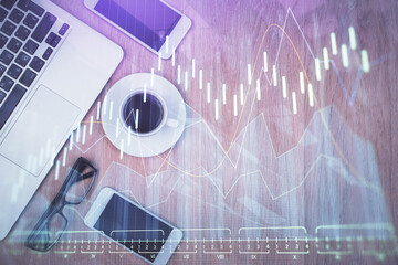 Multi exposure of financial chart hologram over desktop with phone. Top view. Mobile trade platform concept.