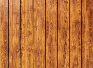 The texture of a shiny wooden fence. The structure of the fence made of wooden boards