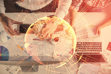 Fototapeta na wymiar Double exposure of man and woman working together and social network theme hologram drawing. Computer background. connecting concept. Top View.