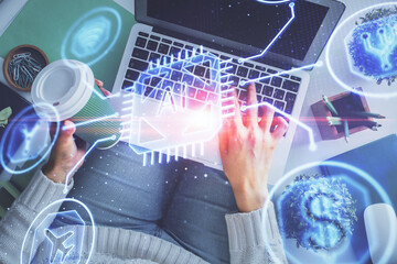 Double exposure of woman hands working on computer and data theme hologram drawing. Top View. Technology concept.