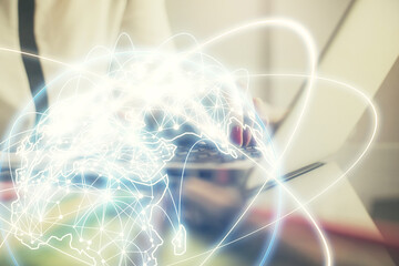 Multi exposure of woman hands typing on computer and business theme hologram drawing. Success...
