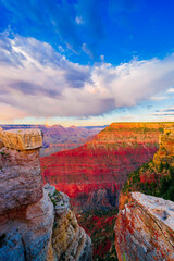 Panoramic image of the colorful Sunset on the Grand Canyon in Grand Canyon National Park from the south rim part,Arizona,USA, on a sunny cloudy day with blue or gloden sky