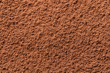 Cocoa powder background, top view. Good contrast light.