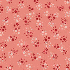 Vector seamless pattern with small scattered pink and red flowers. Elegant minimal floral background. Simple ditsy texture. Liberty style wallpapers. Repeat design for print, decor, fabric, clothing
