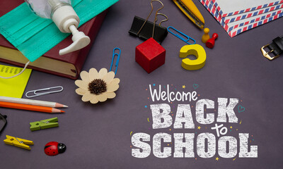 Welcome back to school with hand sanitizer and stationery items banner