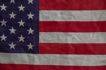 Old rustic flag of United States making a flat background