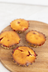 Cherry Cup Cakes served on the plate above white background