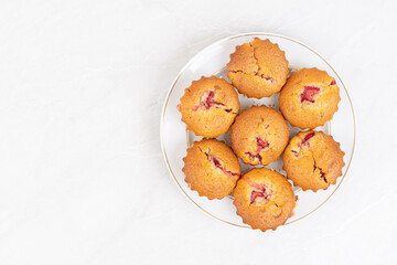 Cup cakes with cherries in the silicone mold