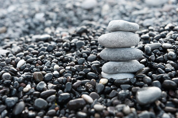 Stones pyramid on the beach. Zen and harmony concept.