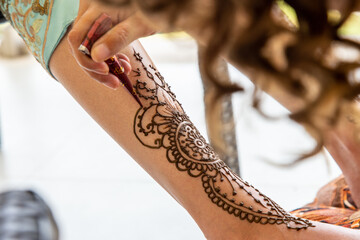 Beautiful Sikh model having henna designed and placed upon her body