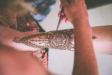 Beautiful Sikh model having henna designed and placed upon her body