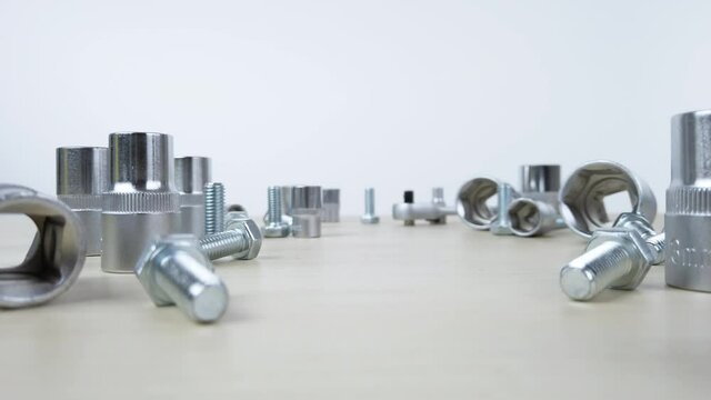 Moving through ratcheting socket wrench sockets and bolts